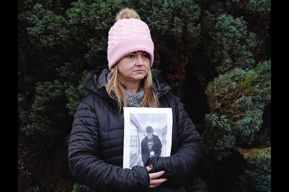 Brittany Dube with a photo of her uncle Chris Dube, a dementia resident at Veterans Memorial Lodge who went missing and was found dead a week later. ADRIAN LAM, TIMES COLONIST 