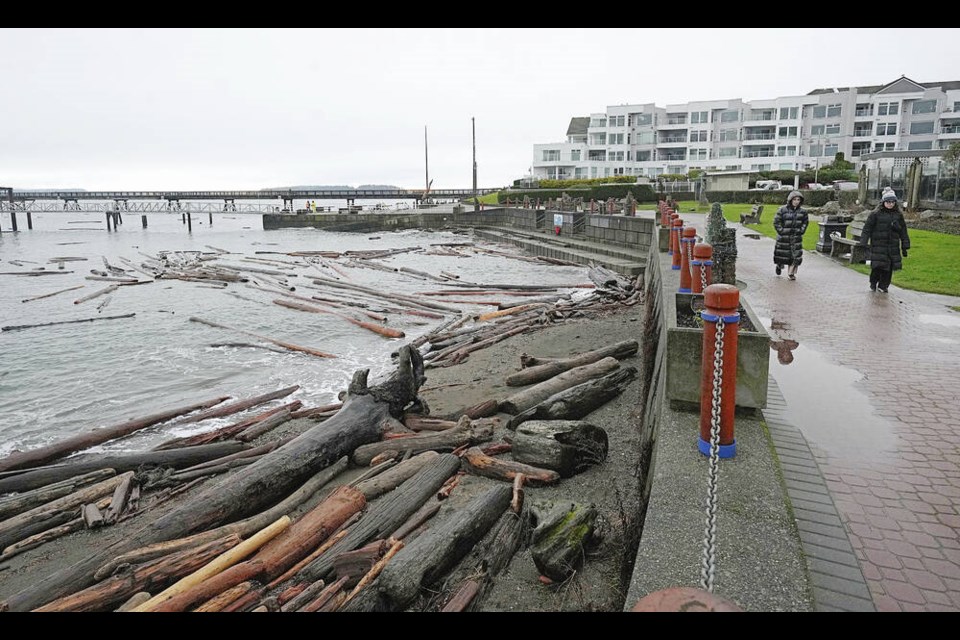 Logs are seen piled up along Sidney’s waterfront on Monday in the wake of a weekend storm. Ocean levels remain high and more rain is in the forecast. Story, A4 ADRIAN LAM, TIMES COLONIST 