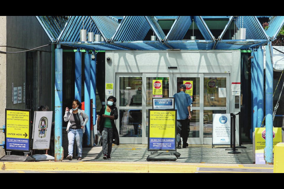 People wear masks as they leave Victoria General Hospital in 2021. ADRIAN LAM, TIMES COLONIST 