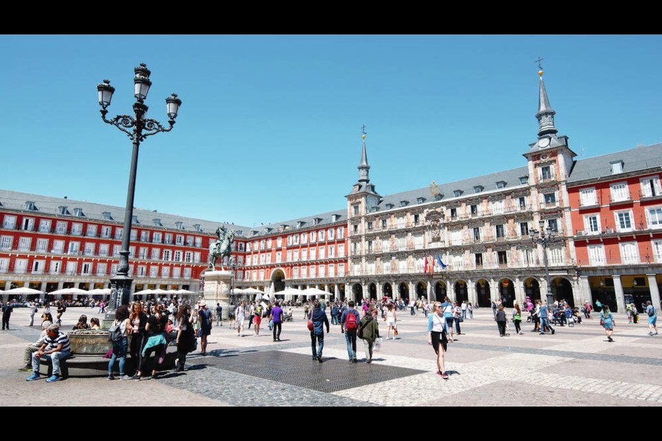 Madrid’s cobbled Plaza Mayor has seen centuries of history, from bullfights to carnival celebrations to gruesome events of the Inquisition. CAMERON HEWITT  