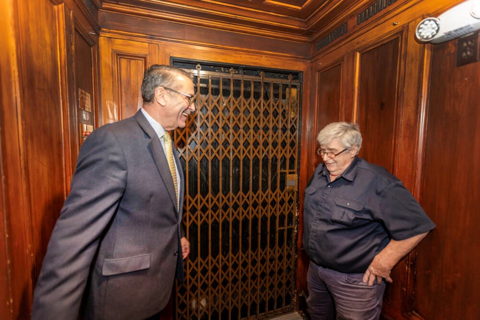 Union Club general manager David Hammonds, left, and Rick Dwyer use the club’s 1913 Otis elevator. DARREN STONE, TIMES COLONIST 