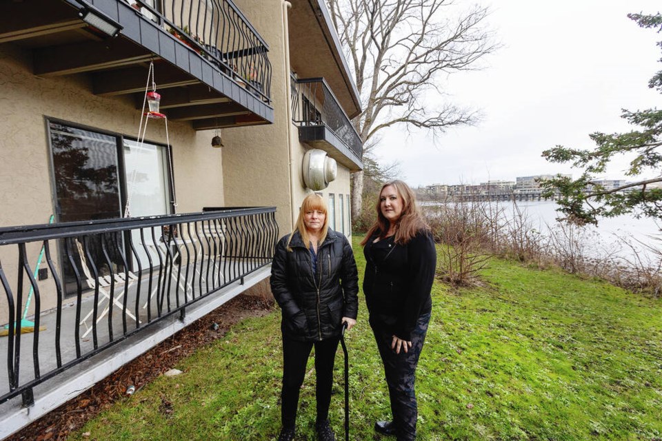 Residents Shannon Butt, left, and Christina Baker at the ­Gordreau Apartments on Gorge Road East. DARREN STONE, TIMES COLONIST 