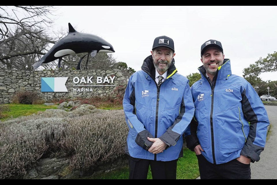 At Oak Bay Marina on Monday, Graham Clarke, head of the Graham Clarke Group, left, meets with Brook Castelsky, CEO of the Oak Bay Marine Group, who will stay on after Clarke’s company takes over. ADRIAN LAM, TIMES COLONIST 