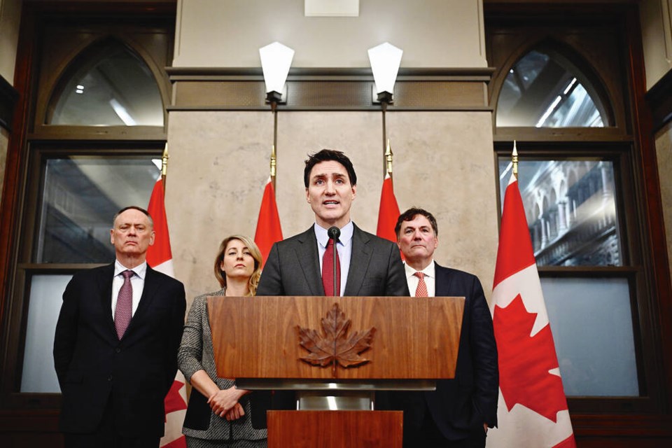 Prime Minister Justin Trudeau holds a news conference on U.S. President Donald Trump’s tariffs against Canada, Mexico and China, in Ottawa, Saturday. With Trudeau are Minister of Public Safety David McGuinty, left, Foreign Affairs Minister Melanie Joly and Minister of ­Governmental Affairs Dominic LeBlanc. JUSTIN TANG, THE CANADIAN PRESS 