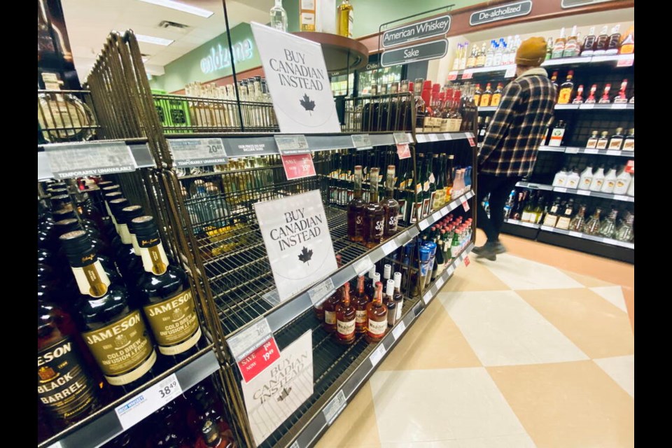 Signs at a liquor store in Sooke, B.C. where American bourbon had been removed from shelves.     DARREN STONE, TIMES COLONIST