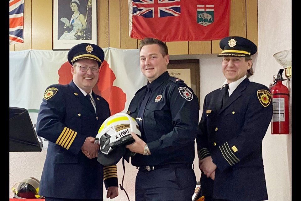 Fire Chief Tyson Van Eaton (left) presents awards to Wallace District Fire Department firefighters on May 8. Aaron Lewis is appointed as Deputy Chief of Stn. 2 (Elkhorn). Travis McColl (right) is one of two former deputy chiefs stepping down from the position.